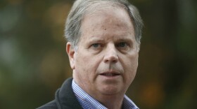FILE- In this Dec. 4, 2017 file photo, Democratic senatorial candidate Doug Jones speaks at a news conference, in Dolomite, Ala. In Alabamas special Senate election, underdog  Jones and his fellow Democrats are intent on not sinking his upset bid against Republican Roy Moore.   (AP Photo/Brynn Anderson, File)