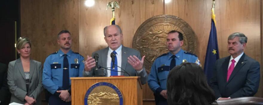Gov. Bill Walker speaks about his public safety plan in the Capitol on Monday. Listening to him are: Alaska Attorney General Jahna Lindemuth, Alaska State Troopers Director Col. Hans Brinke, Alaska Wildlife Troopers Director Col. Steve Hall, and Public Safety Commissioner Walt Monegan. (Photo by Andrew Kitchenman/KTOO)