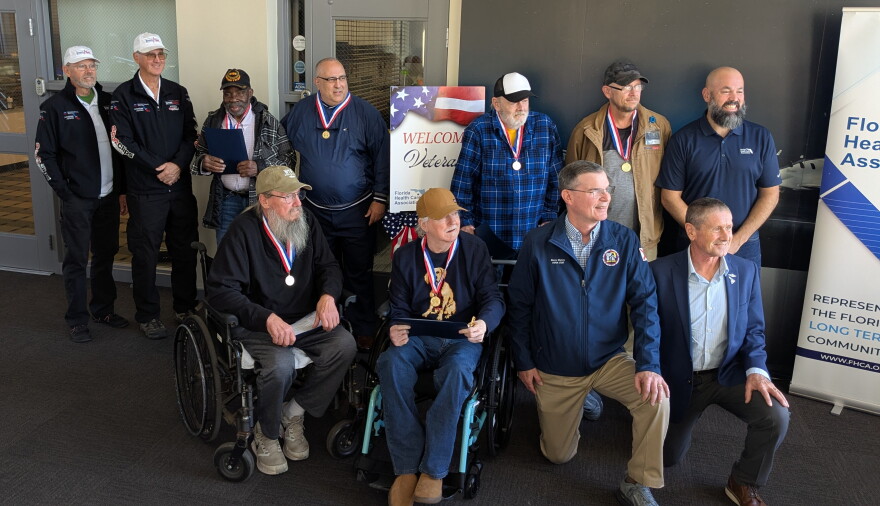 The 6 Dream Flight recipients pose for a pre-flight photo with