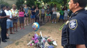 Neighbors, police and pastors gather at a vigil for Torrence Spillers.