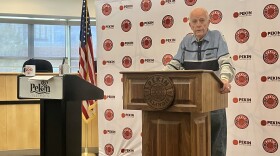 William Jansen speaks from the new podium the family of the late Bill Jansen, Pekin's city clerk for 40 years, purchased for the city council chambers. Next to William is the former podium.