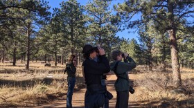  Kieran Schnitzspahn (left) and Owen Robertson spotting a gray-headed junco on a trail in south Boulder during the Christmas Bird Count on December 17, 2023.