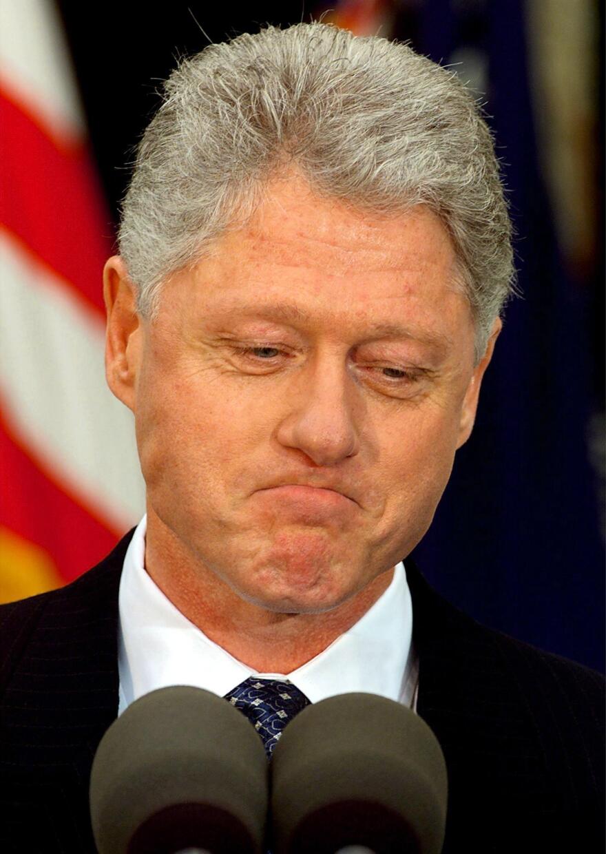 President Bill Clinton pauses while reading a statement after the Senate voted not to impeach him on Feb. 12, 1999. Clinton apologized for the actions that led to his impeachment and subsequent acquittal.