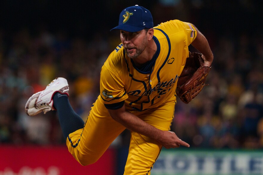 Retired St. Louis Cardinals pitcher Adam Wainwright throws a pitch during a baseball game between the Savannah Bananas and the Party Animals at Busch Stadium on Friday, July 18, 2025, in downtown St. Louis.