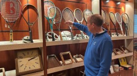 Dr. Mike Eden’s tennis memorabilia collection includes hundreds of racquets