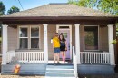 Joel Roop-Eckart and Belle Barnes pose in front of their Central City neighborhood fixer-upper.