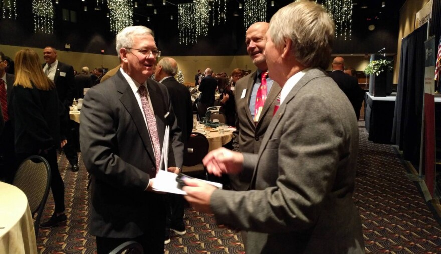 Michael Hicks (left) tells the regional business community that area jobs aren't attractive en masse.