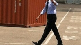 Pres. Barack Obama waves to reporters at the Port of Tampa.