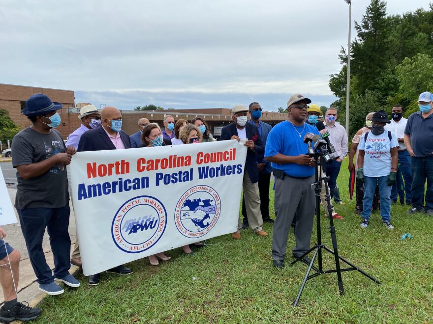 APWU President Tony Wilson speaks outside the USPS Facility on Scott Futrell Drive