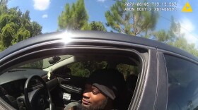 In a screenshot from a sheriff's body camera video, Darius Jermaine Ned Thomas Jr., 22, of Jacksonville, Florida, leans out his driver's window Aug. 5, 2022, to accept a $114 ticket from Jacksonville Sheriff's Office deputy M.L. Albert for playing his music too loudly. Black drivers, like Thomas, are more than three times as likely as whites to be pulled over and ticketed under the law, according to a new investigation by the University of Florida College of Journalism and Communications. (Photo courtesy of Jacksonville Sheriff's Office)