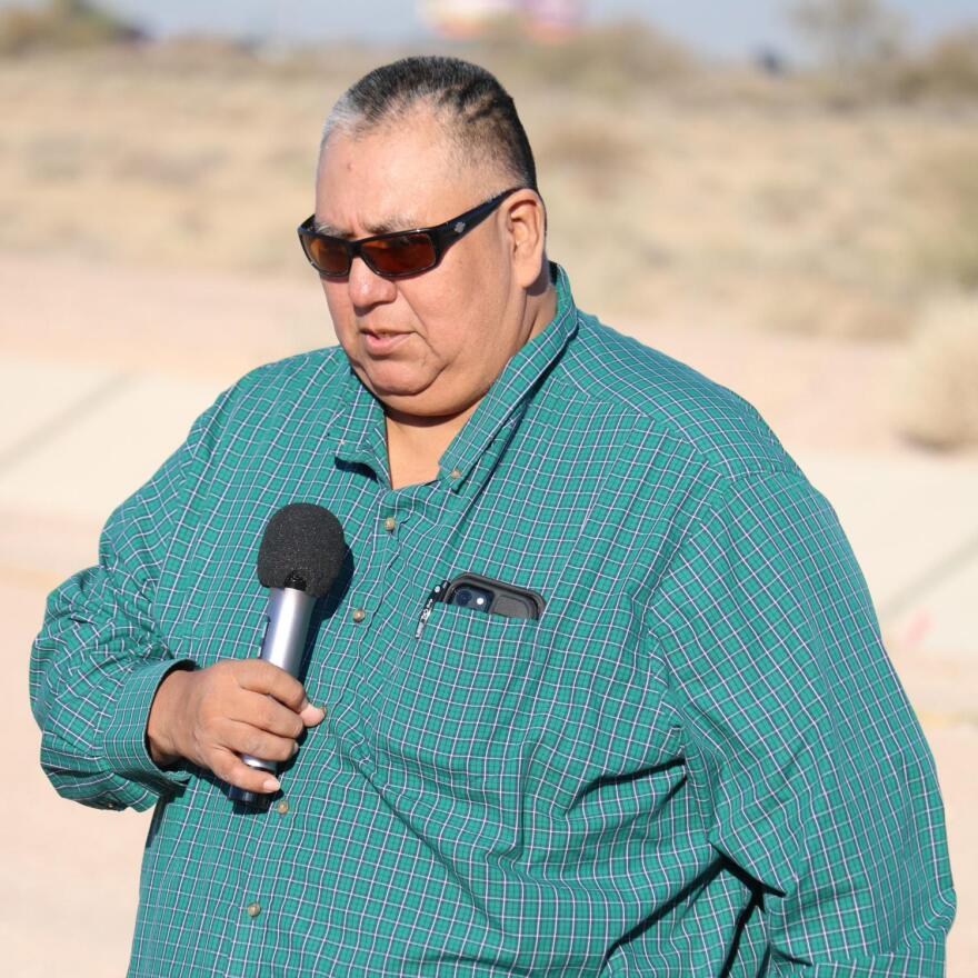 GRIC Councilman Gordon Santos, Jr., of District 5, praises water and prays for the safety of workers who ready to begin installing solar panels atop the Casa Blanca Canal.