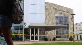 Morgan State University student walks past an evacuated Earl S. Richardson Library on Tuesday, Sept. 30, 2025.