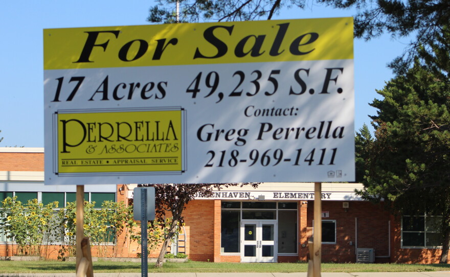 A "For Sale" sign is posted outside Greenhaven Elementary on Aug. 27, 2026, in Hibbing. The school closed in June.