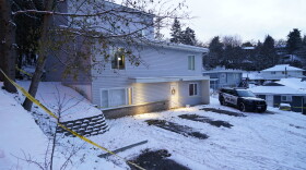 FILE - Bare spots are seen, Nov. 29, 2022, in the snowy parking lot in front of the home where four University of Idaho students were found dead on Nov. 13, in Moscow, Idaho, after vehicles belonging to the victims and others were towed away earlier in the day. Objections have been raised to demolishing the house where four University of Idaho students were killed in 2022, with members of three of the victims' families signaling it should be preserved until after the trial of the man charged in the deaths.