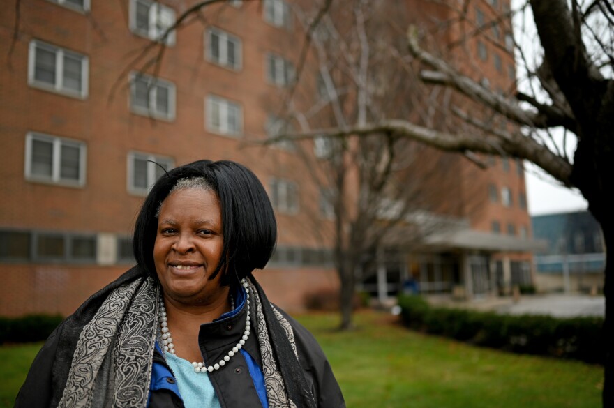 Angela Smith, 48, outside the Cedar Extension High-Rise senior apartments, where she lives with her mother, Minnie. [Tim Harrison / special to ideastream]