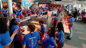Military families line up for pantry supplies at a Blue Star Family event at the Virginia Air and Space Museum in Hampton.