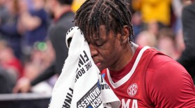 Alabama's Aiden Sherrell (22) wipes his face after losing to Michigan in a Sweet 16 NCAA college basketball tournament game, Friday, March 27, 2026, in Chicago. (AP Photo/Nam Y. Huh)