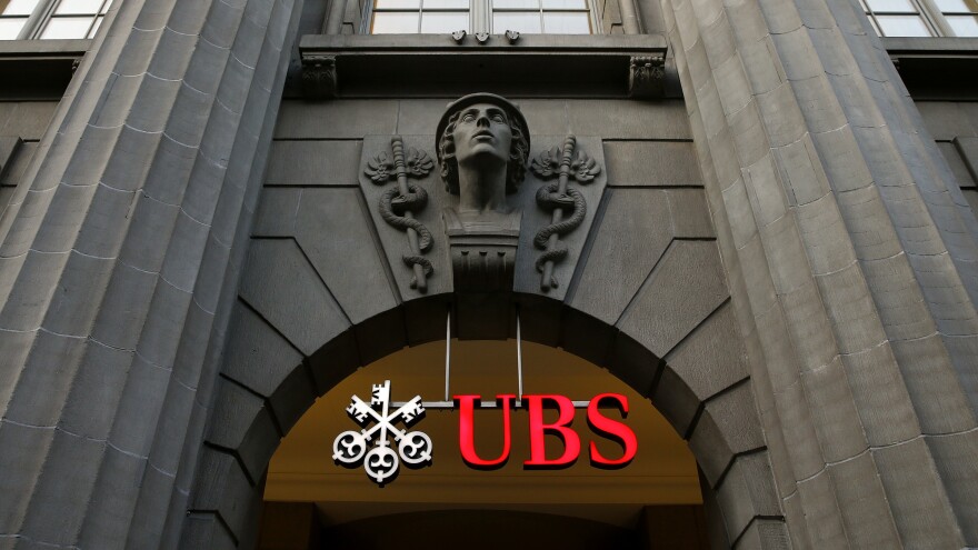 The logo of Swiss bank UBS is seen at the company's headquarters in Zurich. U.S. officials are investigating whether UBS and Barclays manipulated currency rates at a time when they were already operating under a deferred prosecution agreement for manipulating interest rates.