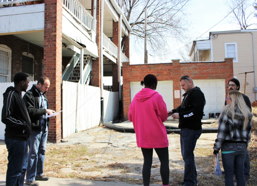 Residents, police and a county official prepare to canvass a part of Pendletons Heights. Neighborhoods in Kansas City's Northeast experienced a significant crime drop over the last year.