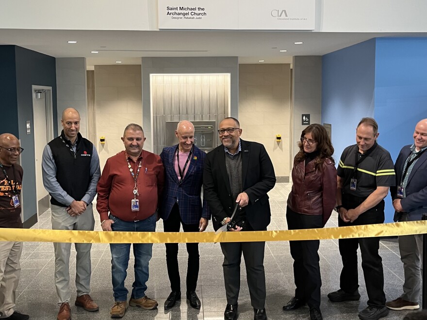 Officials cut the ribbon at new restrooms at the centralized security checkpoint at Cleveland Hopkins International Airport. The new bathrooms include universal changing tables to accommodate people with disabilities.