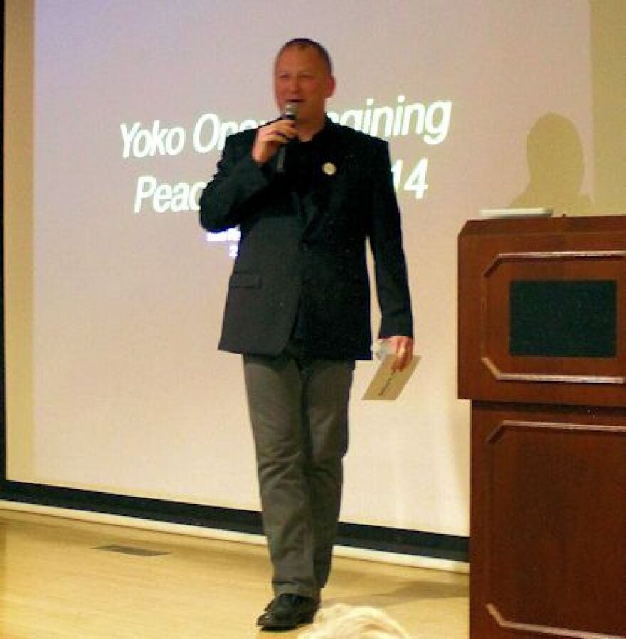 Dellinger making opening comments at Yoko Ono 'Imagining Peace' exhibit in 2014.