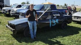 Korbin Papadopoulos poses before his first demolition derby competition in August 2025 in Macon. He chose his father's derby number, 13, for his car and added K for his first name.
