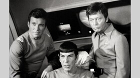 William Shatner, Leonard Nimoy, and DeForest Kelley appear together in the film Star Trek. Shatner played the role of Captain James T. Kirk, Nimoy appeared as Mr. Spock, and Kelley as Dr. Leonard "Bones" McCoy. They were all inhabitants of the Starship Enterprise.