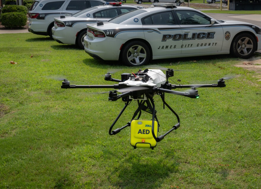 A drone carrying a defibrillator lifts off as part of a demonstration of the technology.