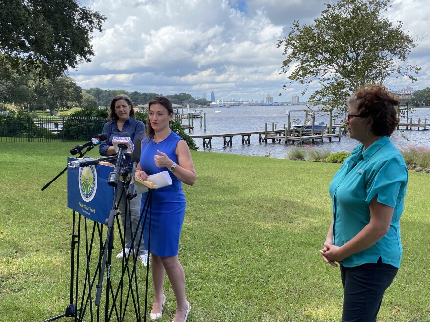  Nikki Fried at a private residence along the St. Johns River, flanked by St. Johns Riverkeeper Lisa Rinaman (right) and St. Johns Riverkeeper board member Lisa King (left).