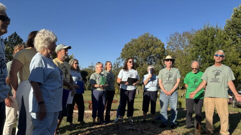 Members of the Kentucky Climate Choir sing at African Cemetery#2 in Lexington.