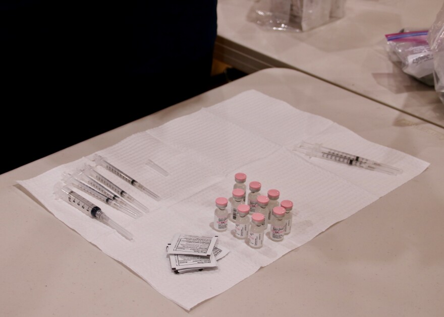 Vials of the Pfizer vaccine are ready to be administered at a health district vaccine clinic in Buhl