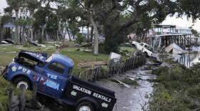 pickup truck sits in a canal
