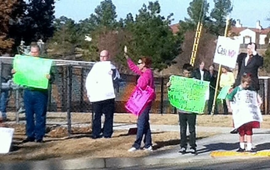 Residents gather across the street from a casino construction site in south Broken Arrow.