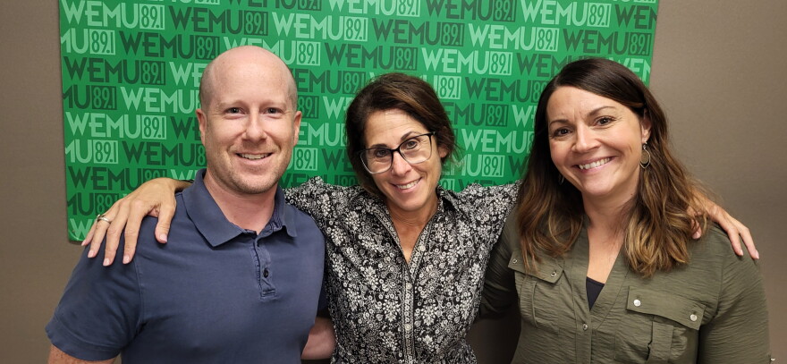 Avalon Housing interim co-executive directors Scott Ellis and Molly Smith, plus Washtenaw United host Decky Alexander (center) at the Timko Broadcast Center.