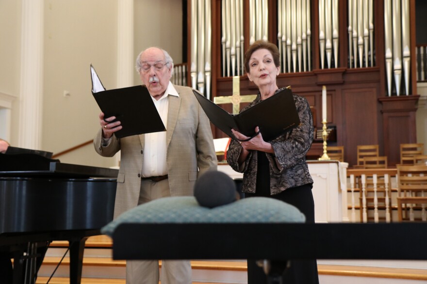 Ronald Burrichter, 83, and Brenda Smith, 72, a married couple, sing alongside each other during a concert series at First Presbyterian Church. (Nicole Beltran/WUFT News)