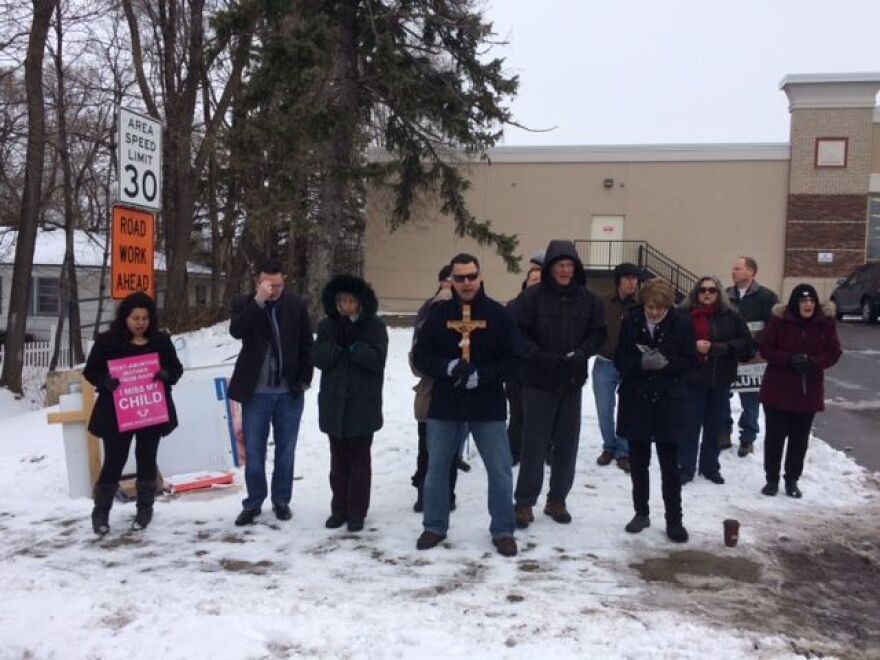 Anti-Planned Parenthood protestors gather in prayer