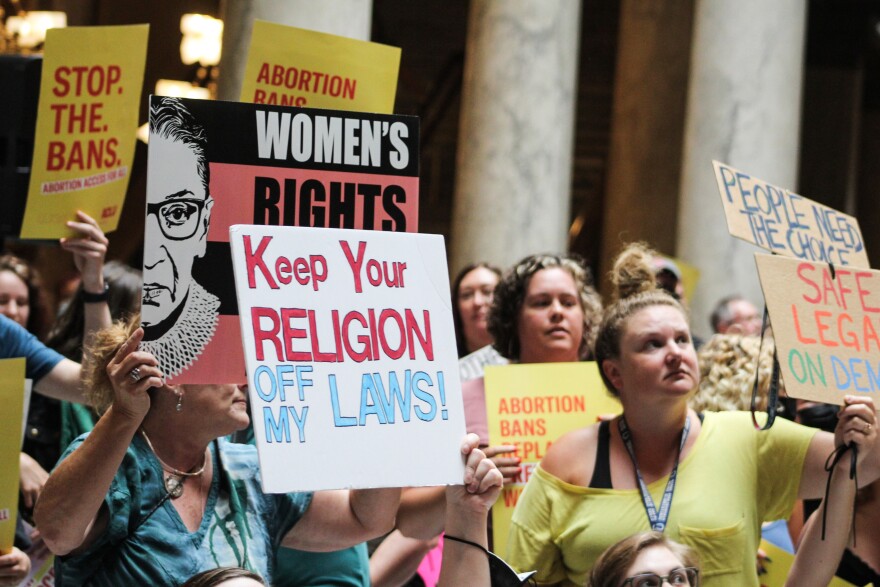 Protesters rally at the Statehouse during a legislative debate in the summer of 2022 over Indiana’s near-total abortion ban. The ban only allows abortion if the pregnant person’s life or serious physical health is at risk, in some cases of lethal fetal anomalies and in some cases of rape or incest.
