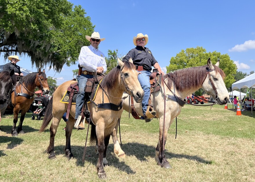 Marion County Sheriff Billy Woods and Lt. Mike Joyner ride horseback at Marion County Day on Saturday, March 28, 2026. (Ameilia McDonough/WUFT News)