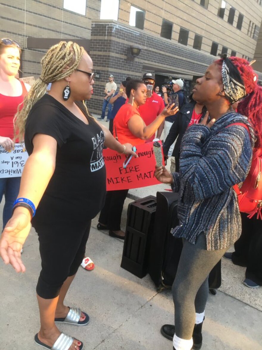 About 100 people gathered Wednesday night on the steps of the Frank Crowley Courts Building in Dallas.