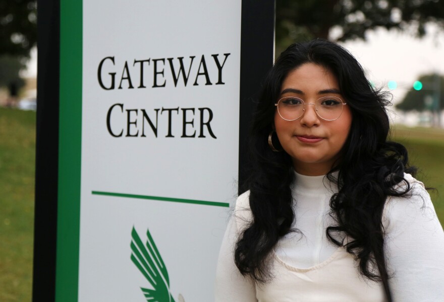 Raquel Ramirez, 25, stands outside the University of North Texas Gateway Center polling place in Denton on Nov. 8, 2022. Ramirez was the first voter in line on Election Day.