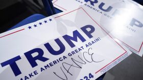 Signs endorsing Republican presidential candidate, former U.S. President Donald Trump along with his pick for Vice President, U.S. Sen. J.D. Vance's (R-OH) name written on it are on the ground on the first day of the Republican National Convention at the Fiserv Forum in Milwaukee, Wisconsin.
