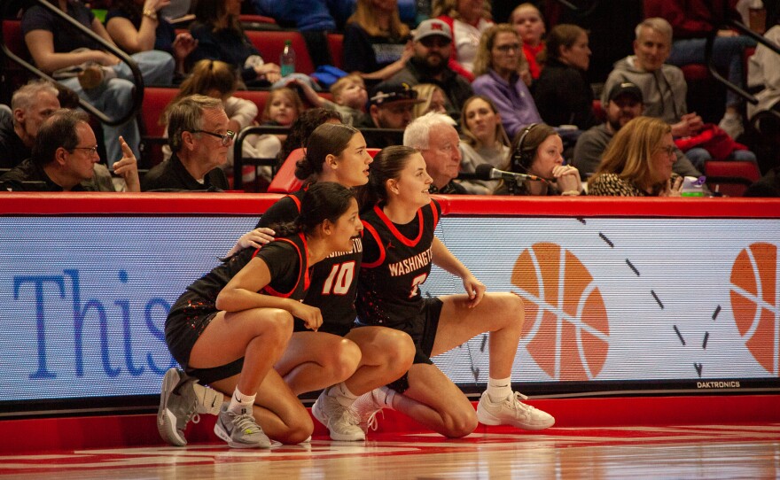 Girls high school basketball players inside an arena