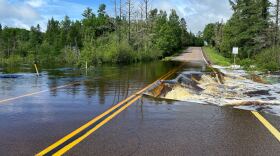 Weiss Creek rushes over Highway 1, also known as Voyageur Highway, Wednesday morning, June 19, 2024, north of Isabella.