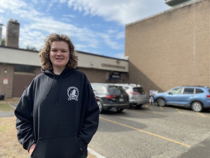 Miles Solsky, 18, voted for the first time in Concord. He has shoulder length wavy brown hair and a black hoodie.