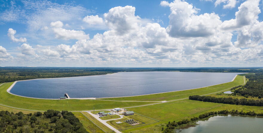 An aerial photo of a relatively full water reservoir.
