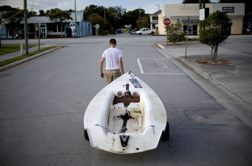 Emmett West pulls his boat from a nearby marina to secure it at his home ahead Hurricane Florence in Morehead City, N.C., Tuesday, Sept. 11, 2018. Florence exploded into a potentially catastrophic hurricane Monday as it closed in on North and South Carolina, carrying winds up to 140 mph (220 kph) and water that could wreak havoc over a wide stretch of the eastern United States later this week. 