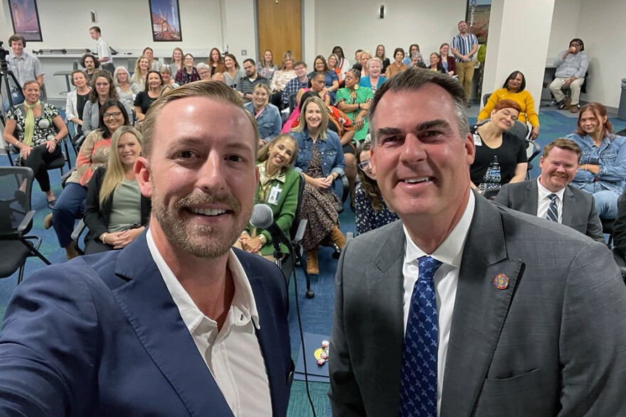 State Superintendent Ryan Walters and Gov. Kevin Stitt post for a selfie in Sept. 2023.