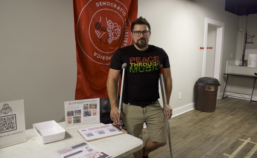 Adrian Gerth, the secretary of the Wilmington Chapter of the Democratic Socialists of America, at the Labor Day concert fundraiser for the unhoused.