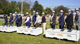Members of the City of Bexley and The Community Builders break ground for new affordable housing development at an event.