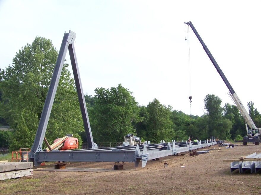 Workers assemble the Eggners Ferry replacement span.